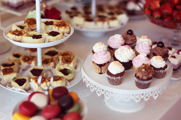 cupcakes,macaroons and sweets in a candy bar
