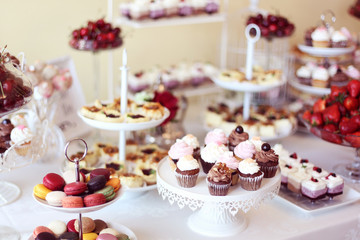 cupcakes,macaroons and sweets in a candy bar