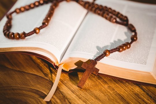Open bible with rosary beads
