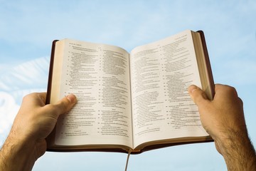 Naklejka premium Man praying with his bible