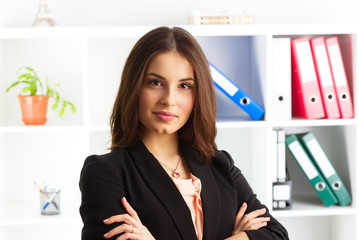 Close-up of pretty smiling woman expert wearing business suit