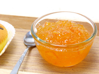 orange jam in glass isolation on white background