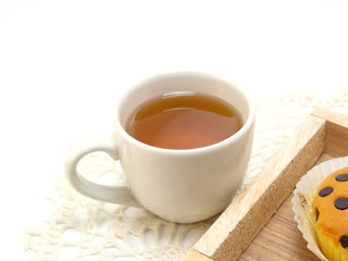 close up herbal tea with cupcake topping with chocolate ships