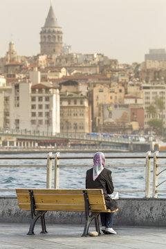 sitting girl with view to Galata tower