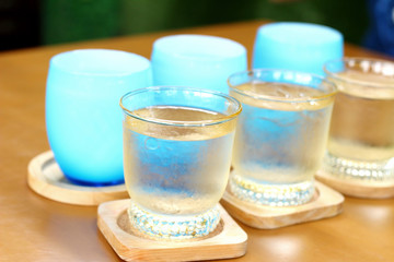 Blue glass of water on table