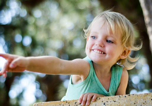 Adorable Toddler Girl Pointing With Finger,  Shallow Focuse