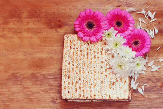 passover background. matzoh (jewish passover bread) and flowers 