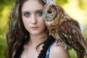 Beautiful young girl with owl