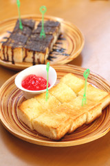 Bread, butter and strawberry jam  - bread topped with chocolate.