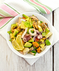 Salad seafood and avocado on white board