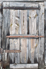 old door made of wooden boards closeup
