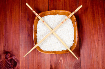 Rice in china cup with chopsticks - obrazy, fototapety, plakaty