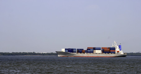 Large container ship arriving on the sea