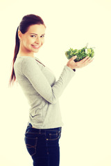 Woman eating lettuce.