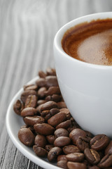 cup of freshly made espresso on wood board