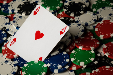 Ace of hearts and poker chips