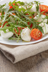 salad with mozzarella cherry tomatoes and arugula