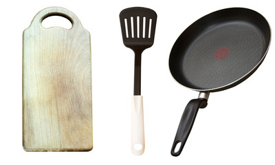 Frying pan, shovel and a wooden board for products