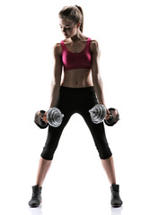 Young girl doing swing exercise with a dumbbells