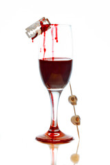 Fototapeta na wymiar Glass with blood and skulls for halloween
