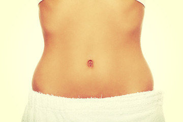 Fit and slim young woman's belly.