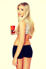 Beautiful young woman drinking beer.