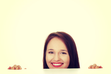 Young happy woman with blank board.
