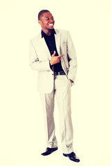 Handsome businessman pointing to something.