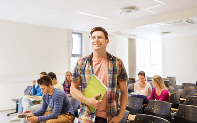 group of smiling students in lecture hall