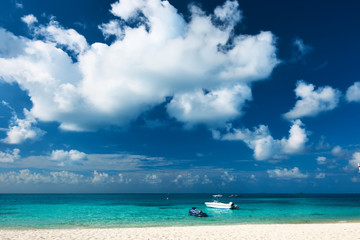Beautiful island beach with motor boat