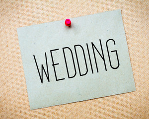 Recycled paper note pinned on cork board.Wedding Message