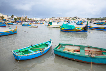 Fototapeta na wymiar Fishing boats in Marsaxlokk Malta