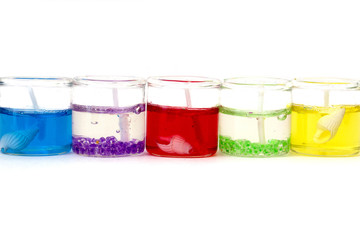 candles in glass horizontally on a white background isolated