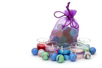 bag with stones and candles on a white background on the right