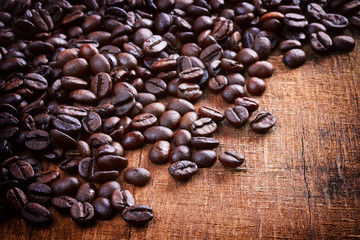 Coffee beans on wood background