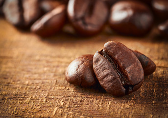 Coffee bean on macro ground coffee background