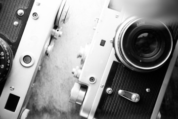 Old retro camera on table.