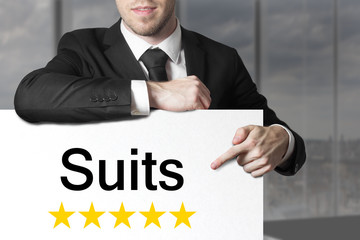businessman pointing on sign suits five stars