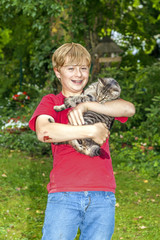 cute boy holding his cat