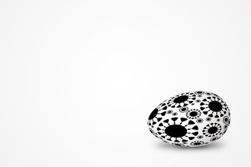 black-and-white easter egg decorated with ornament