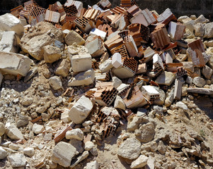 A pile of dirt and busted-up rubble at a construction site.