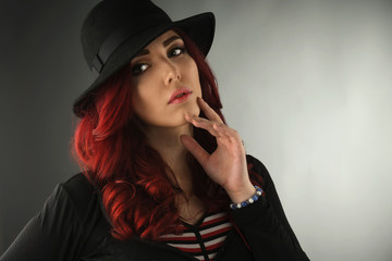 Young redhead wearing a black hat