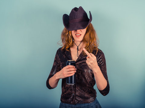 Young woman drinking and being rude