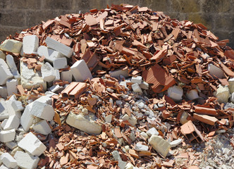 A pile of dirt and busted-up rubble at a construction site.