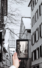 tourist taking photo church and street in Zurich