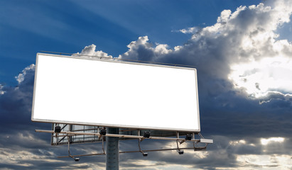 Billboard Blank Screen in front of cloudy sky with sun-rays