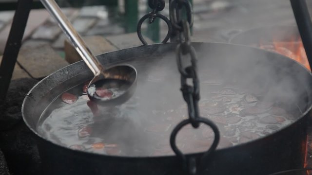 huge copper cauldron with tasty mulled wine