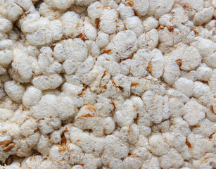 textured surface brown rice cakes for background