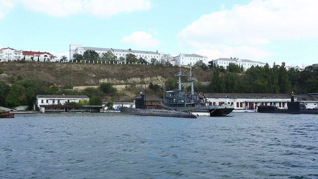 submarine and warship on anchor parking in a bay of Sevastopol