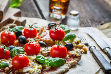 Homemade pizza with mushrooms on baking paper
